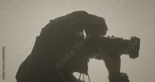 Silhouette Of Male Photographer Taking Photos With Professional Camera. Close up photo