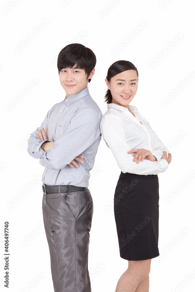 Portrait of businessman and businesswoman standing back to back Portrait of businessman and businesswoman standing back to back