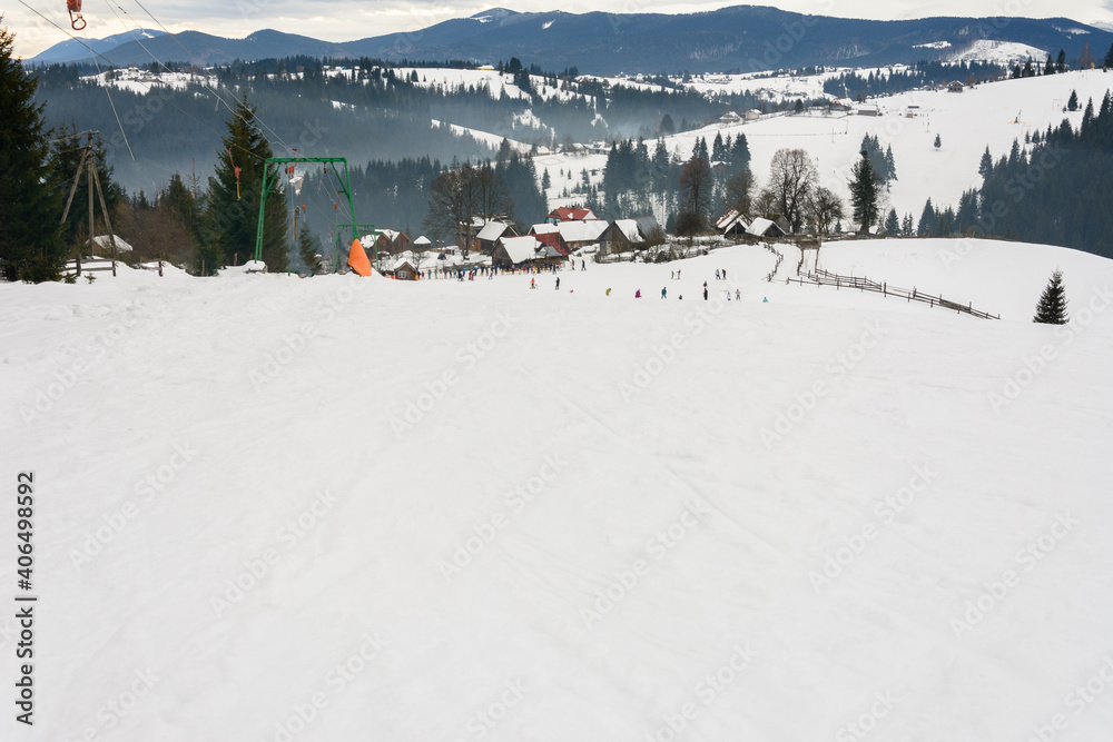 Skiers rest in the Ukrainian Carpathian village in winter.