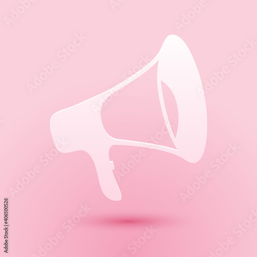 Paper cut Megaphone icon isolated on pink background. Paper art style. Vector.