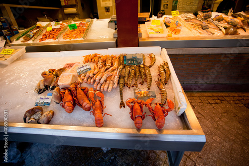 Shrimp, lobster and fish are sold in the market in Normandy