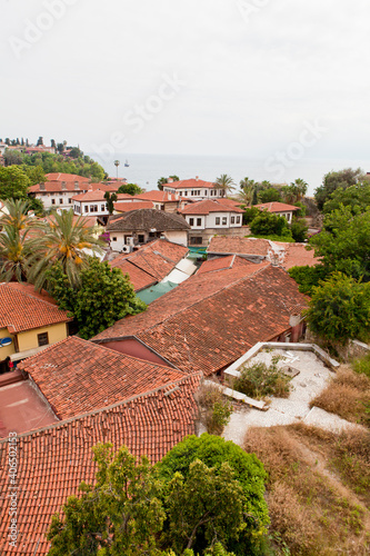 Sea view through the red roofs of the city