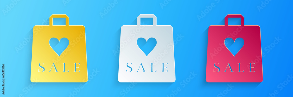 Paper cut Shoping bag with an inscription Sale icon isolated on blue background. Handbag sign. Woman bag icon. Female handbag sign. Paper art style. Vector. Paper cut Shoping bag with an inscription Sale icon isolated on blue background. Handbag sign. Woman bag icon. Female handbag sign. Paper art style. Vector.