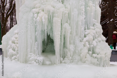 Frozen fountain in winter. The fountain was frozen all over in ice.
