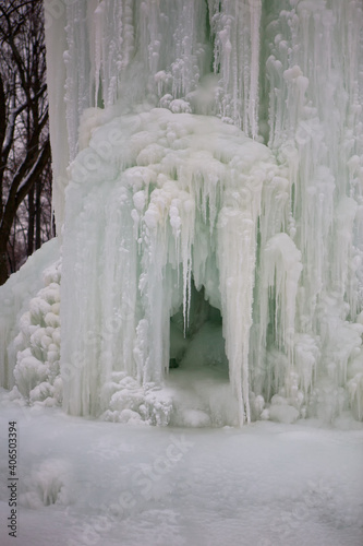 Frozen fountain in winter. The fountain was frozen all over in ice.