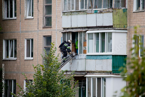 Firefighters on the stairs rescue from the fire