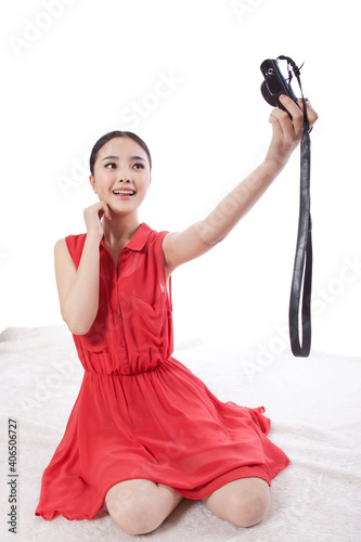 Portrait of a Young woman taking self portrait