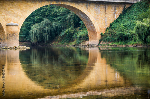 Beautiful Perigord aquaduct reflects in the French river photo