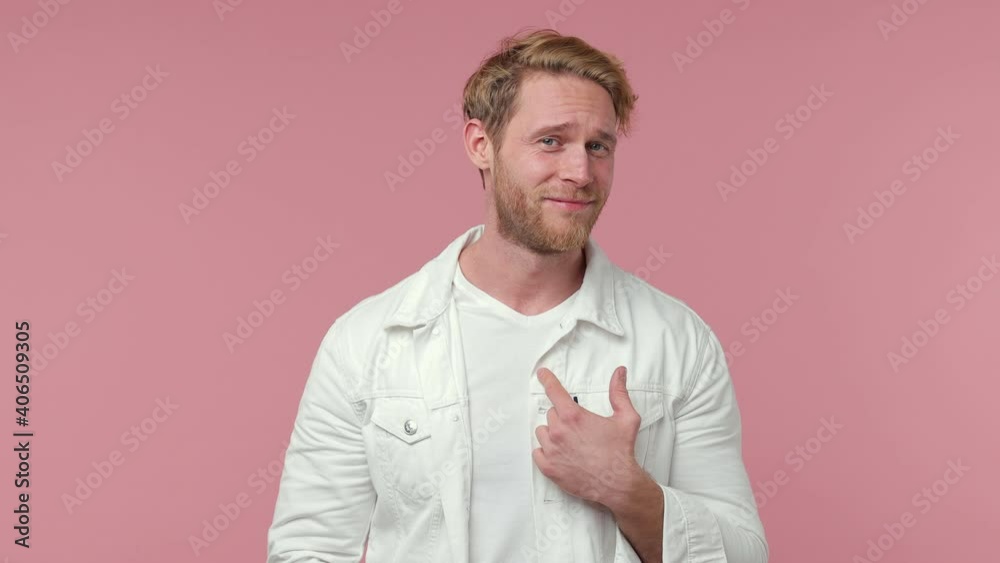 Shocked amazed bearded young man 20s years old in white casual clothes isolated on pink background studio. People lifestyle concept. Pointing fingers himself ask say who me no thanks i do not need it