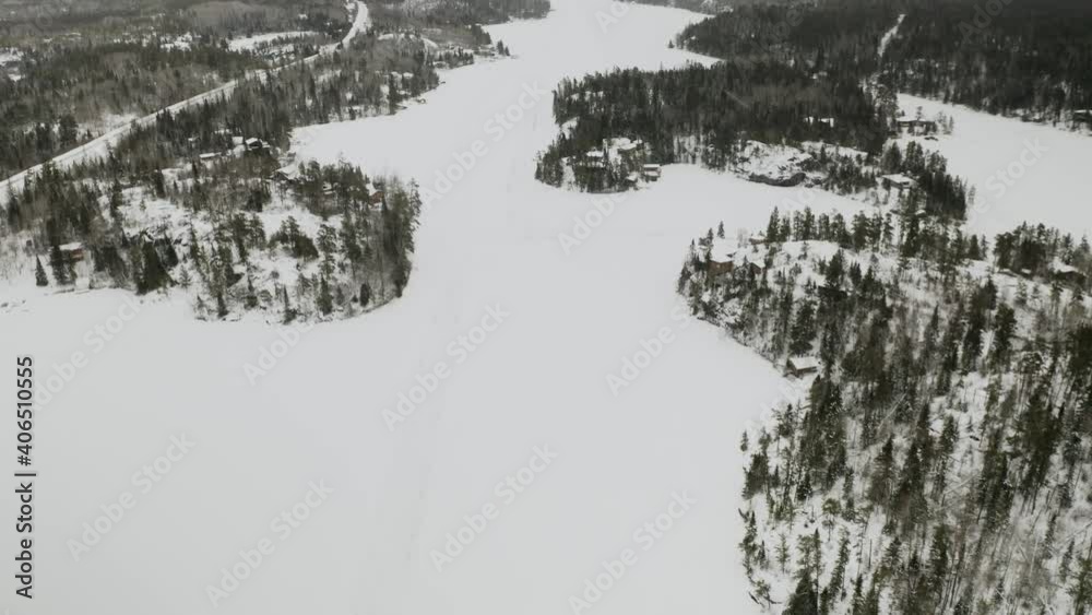 Aerial ascend over Ingolf, Ontario. An idyllic frozen lake hidden in the boreal forest of the Canadian shield. Aerial ascend over Ingolf, Ontario. An idyllic frozen lake hidden in the boreal forest of the Canadian shield.