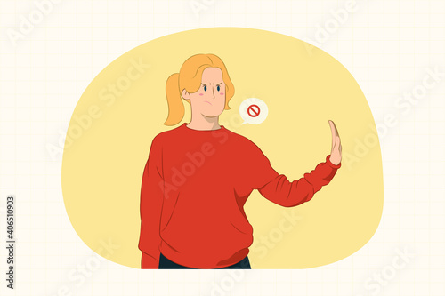 Serious young woman showing stop gesture aside with palm concept