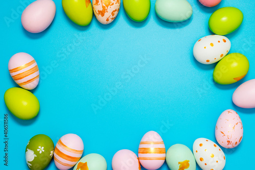 Easter Eggs. Colorful Easter eggs on blue background with copy space