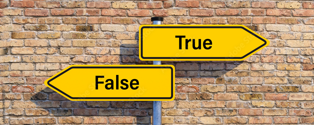 street signs pointing in different directions with the message TRUE and