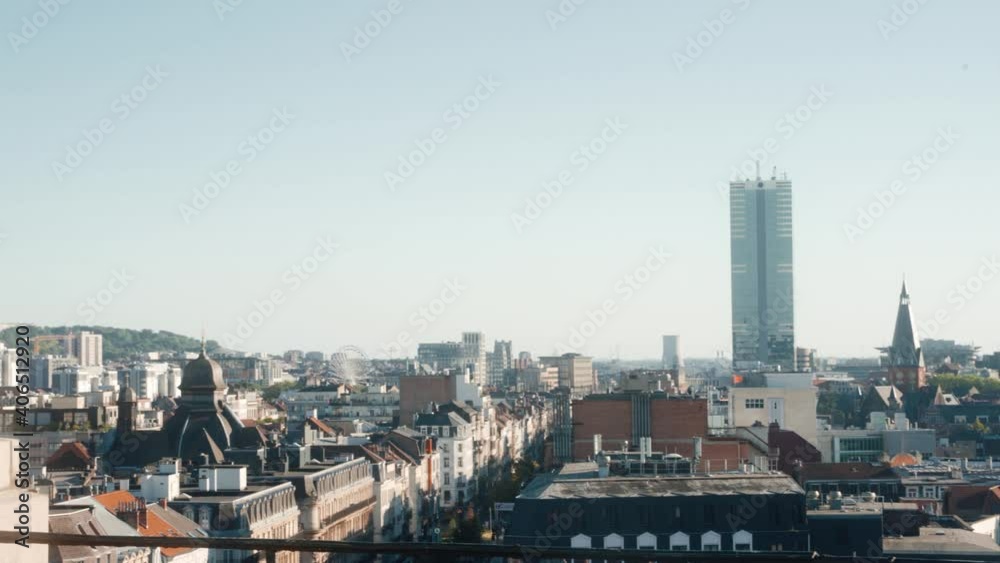View from a rooftop over the Skyline of Brussels around the Brussels South Station area, better known as the Tour du Midi Bruxelles. Shot on a warm summer evening.