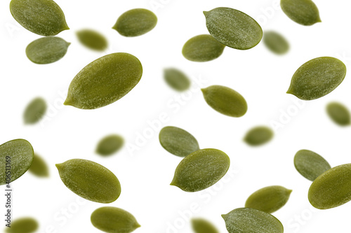 Falling Pumpkin seed, isolated on white background, selective focus