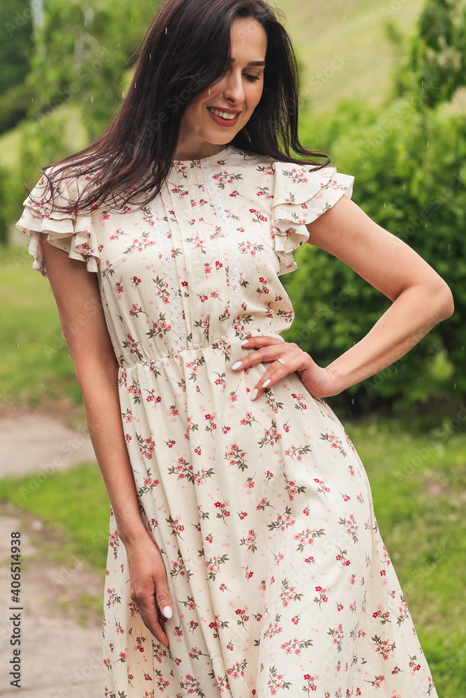 Young elegant girl posing at city street. Pretty beautiful business woman in elegant dress against city background. Young elegant girl posing at city street. Pretty beautiful business woman in elegant dress against city background.