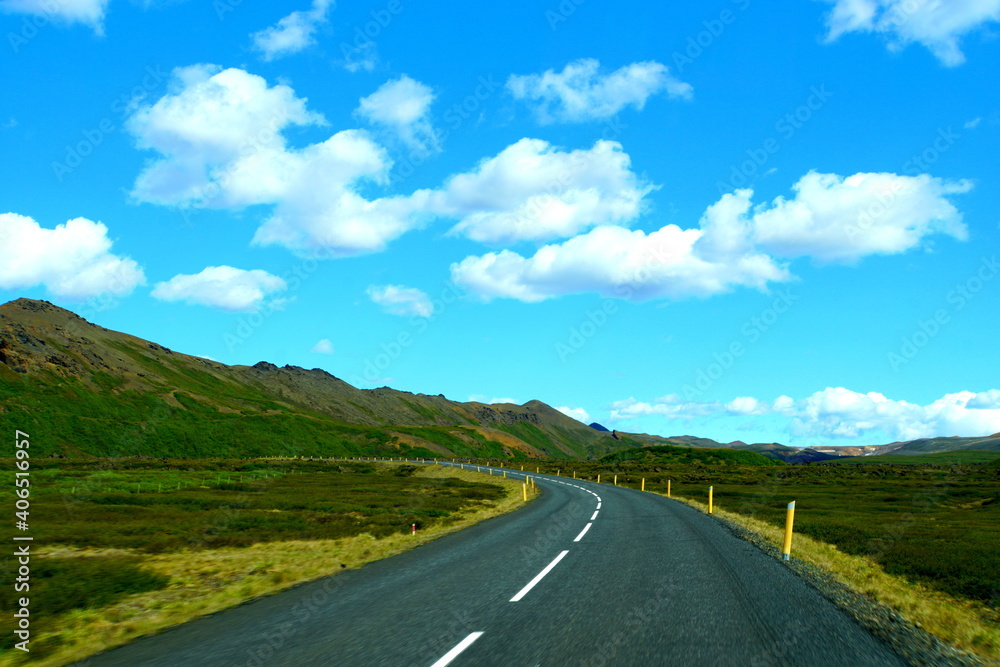 The view of the scenic drive on an empty highway on the Ring Road, Iceland during the summer
