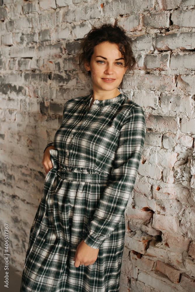 Young elegant girl posing indoor. Pretty beautiful business woman in elegant dress Young elegant girl posing indoor. Pretty beautiful business woman in elegant dress