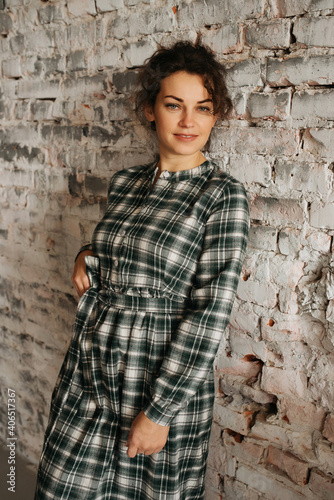 Young elegant girl posing indoor. Pretty beautiful business woman in elegant dress
