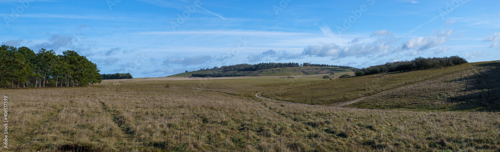 scenic wide angle panoramic view of sidbury hill under an azure blue sky