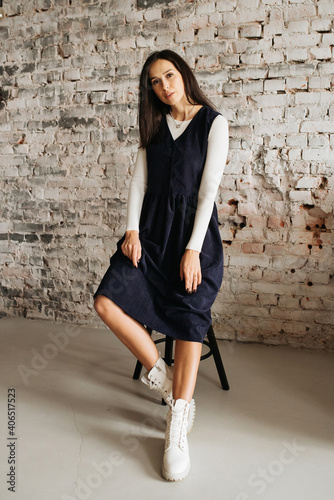 Young elegant girl posing indoor. Pretty beautiful business woman in elegant dress