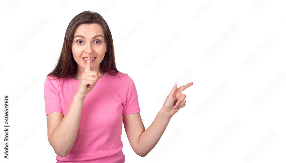 Young brunette woman in pink sweater pointing fingers to the side, isolated on white background. Point to the right. Place for text. Young brunette woman in pink sweater pointing fingers to the side, isolated on white background. Point to the right. Place for text.