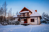 village house in the snowy winter 