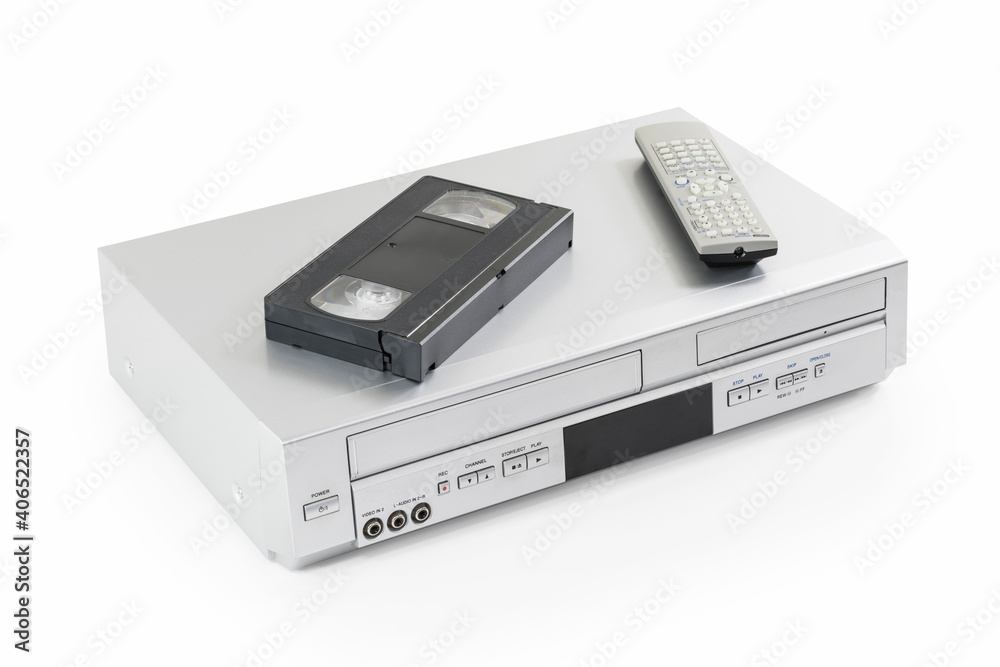 Old video cassette and disk player machine with remote controller, on white. Old video cassette and disk player machine with remote controller, on white.