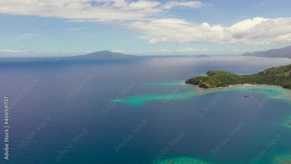 Tropical Islands with beaches and turquoise sea water. Seascape and tropical landscape. Sleeping dinosaur island, Mindanao, Philippines. Tropical Islands with beaches and turquoise sea water. Seascape and tropical landscape. Sleeping dinosaur island, Mindanao, Philippines.