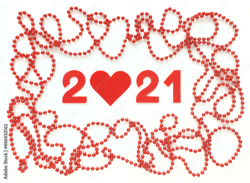 Red felt year numbers 2021 on white background. Zero in the shape of a heart. Red beads around. Valentine's Day. Review of the last year. Red felt year numbers 2021 on white background. Zero in the shape of a heart. Red beads around. Valentine's Day. Review of the last year.