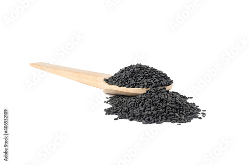 Black Sesame seeds in wooden spoon isolated on white background. Spices and food ingredients. photo