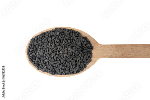 Black Sesame seeds in wooden spoon isolated on white background. Spices and food ingredients.