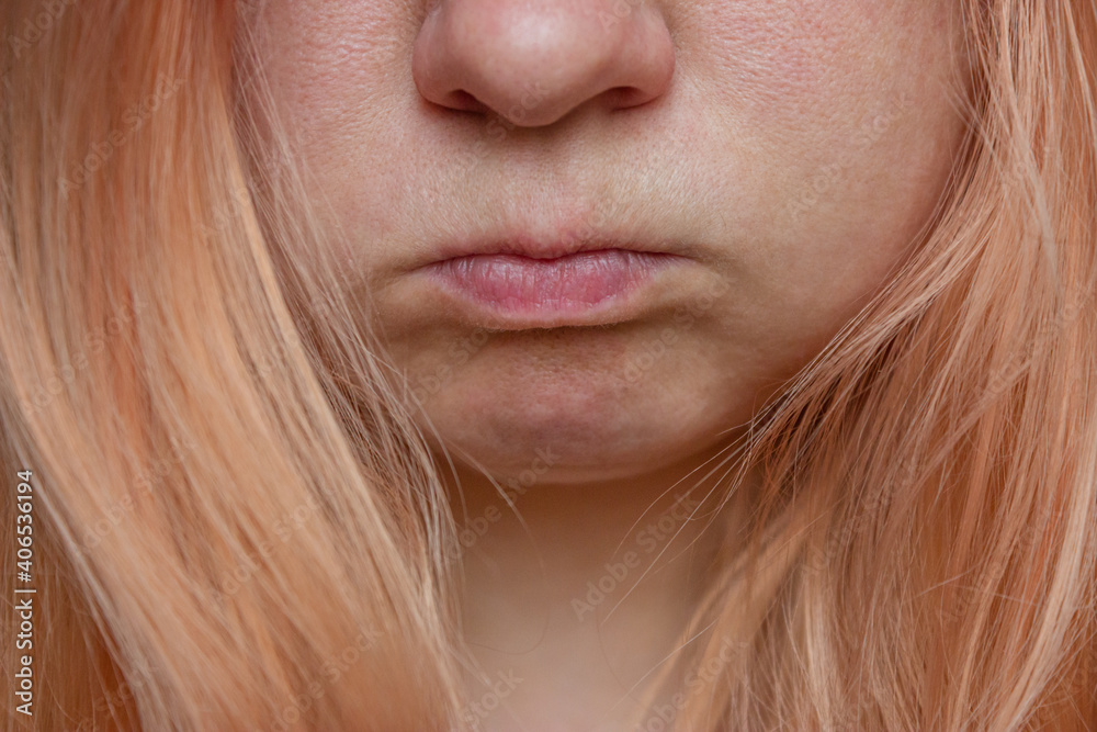 Close-up portrait of a girl with orange hair without makeup and skin retouching. Close-up portrait of a girl with orange hair without makeup and skin retouching.