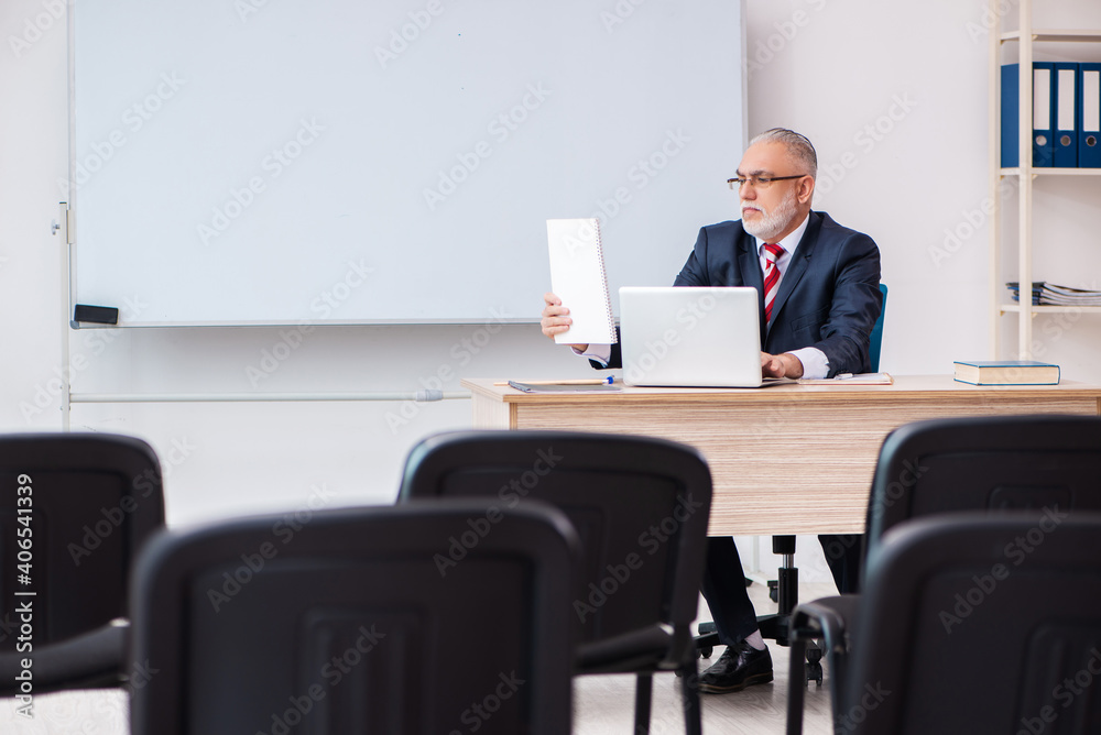 Old male business couch in the classroom during pandemic Old male business couch in the classroom during pandemic