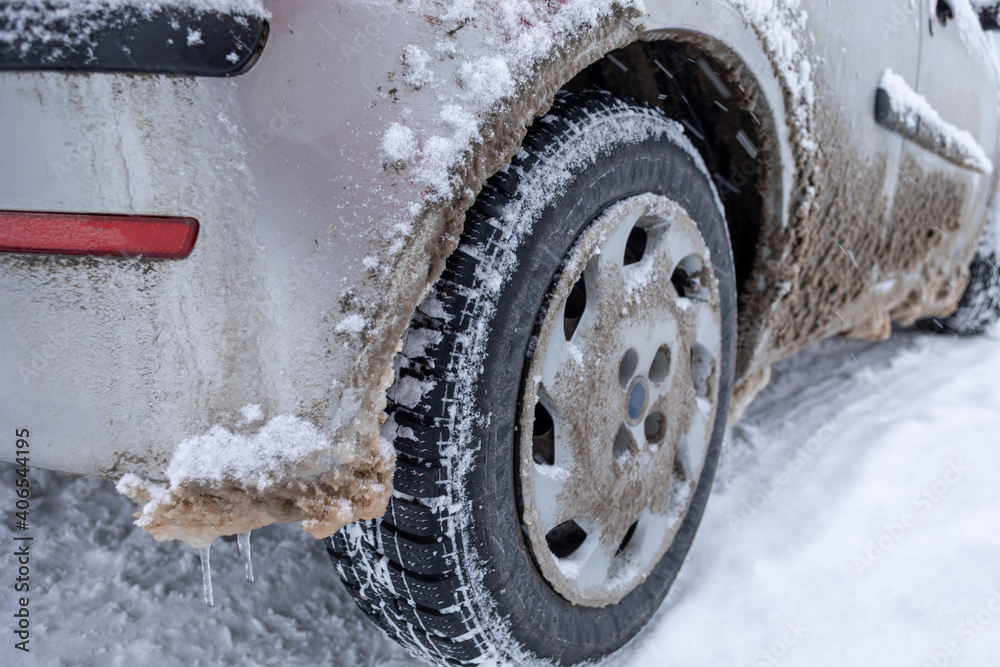 Winter tire. Car on snow road. Tires on snowy highway detail. Winter tire. Car on snow road. Tires on snowy highway detail.