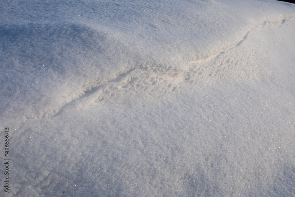 Surface of pure white snow with bumps.Winter image.