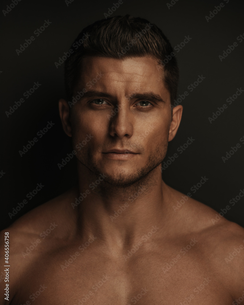 close up portrait of handsome man in studio. Brutal face of male model.