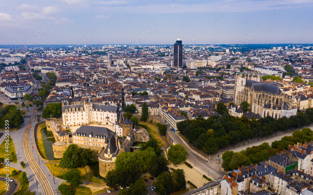 Scenic aerial view of French city of Nantes at cloudy summer day