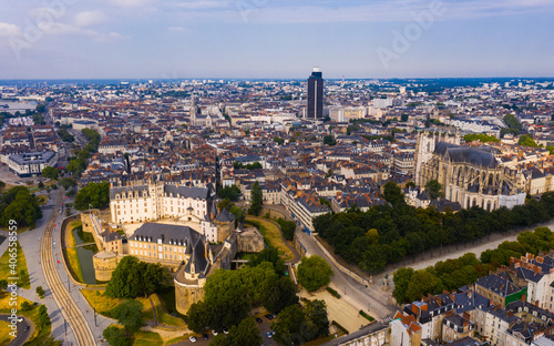 Scenic aerial view of French city of Nantes at cloudy summer day