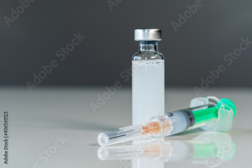 syringe injection and vaccine bottle
