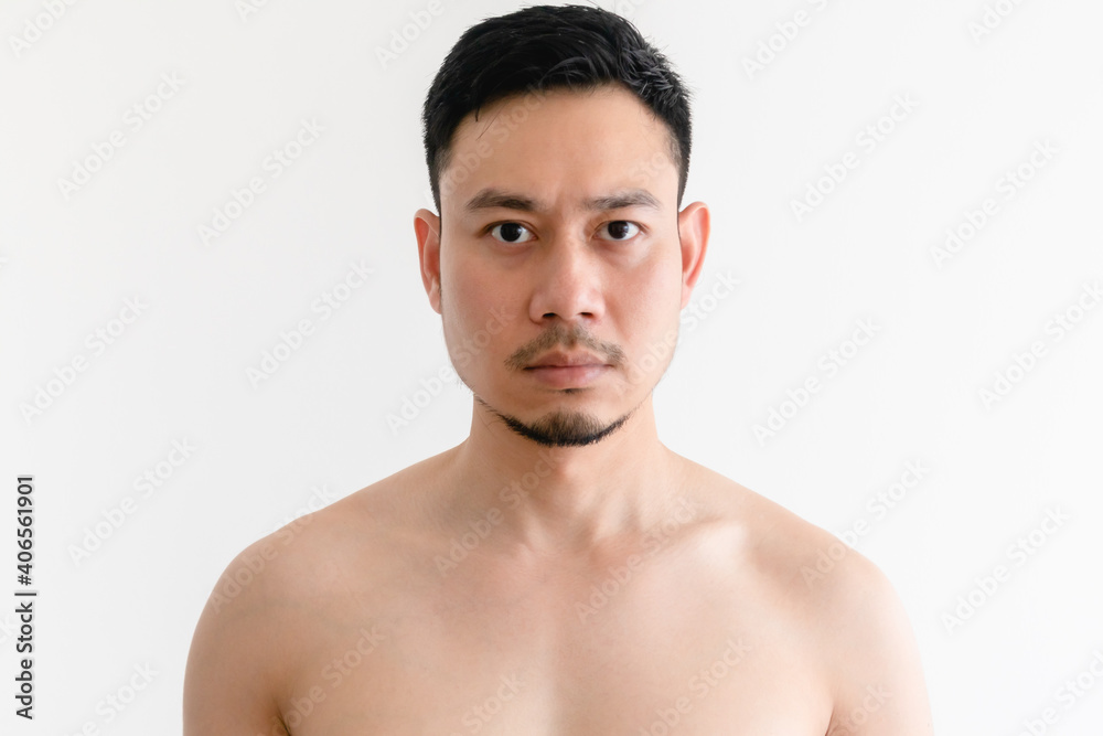 Portrait of topless Asian man with serious face on isolated background. Portrait of topless Asian man with serious face on isolated background.