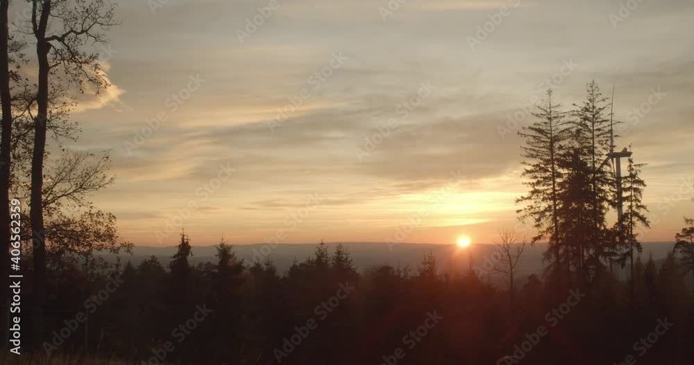 Sunset over a forrest in Hesse with beautiful clouds in the sky Sunset over a forrest in Hesse with beautiful clouds in the sky