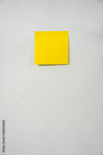 yellow sticky note on wall