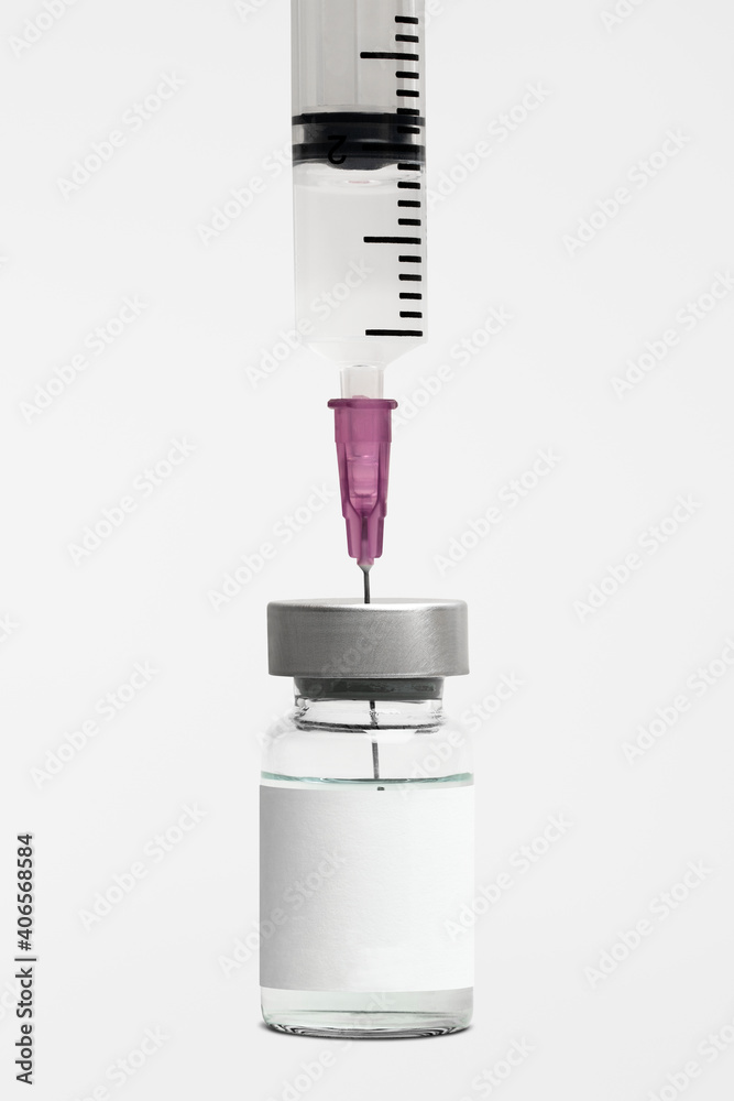 Blank white label on injection bottle glass vial with syringe