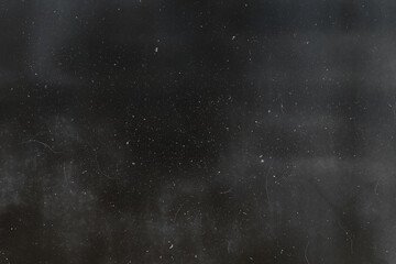 Abstract dirty or aging film. Dust particle and grain texture or dirt use for overlay film frame effect with space for vintage grunge design.