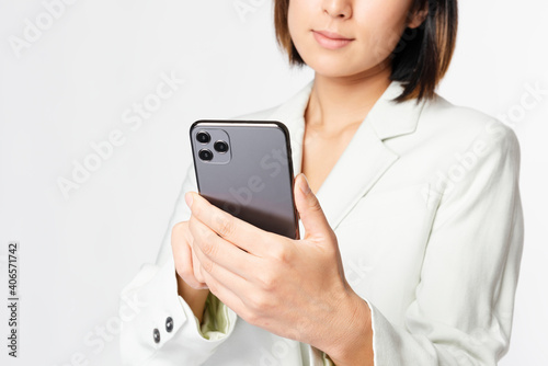 Young businesswoman holding smartphone innovative future technology