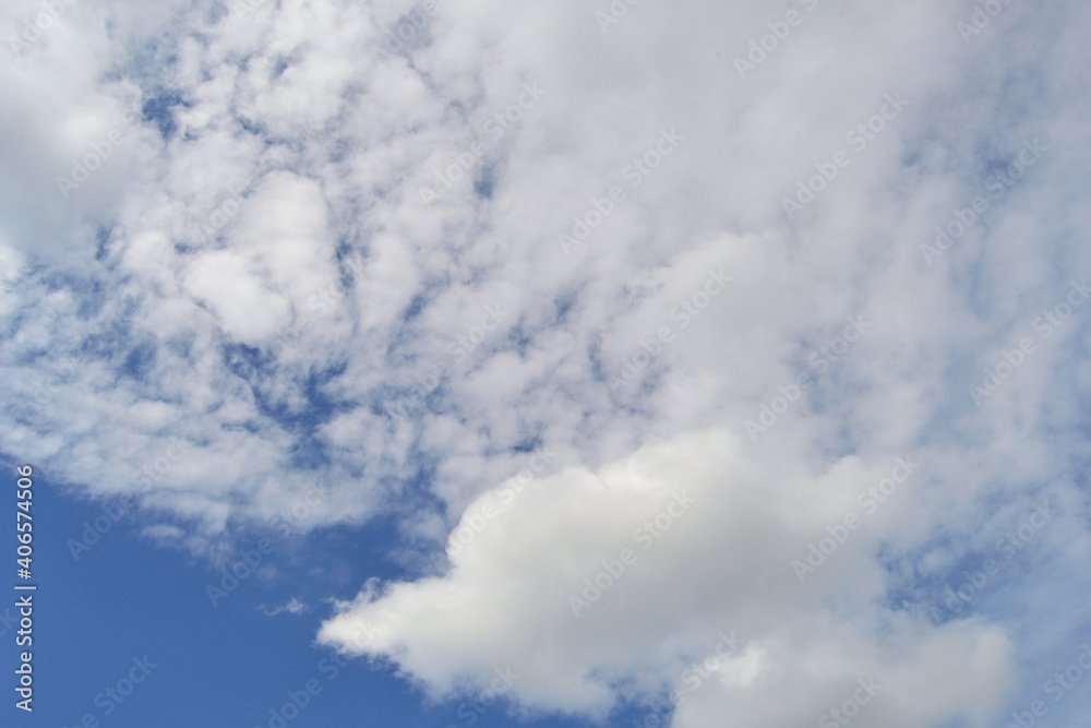 Summer background with blue sky and fluffy white clouds in daylight. Summer background with blue sky and fluffy white clouds in daylight.