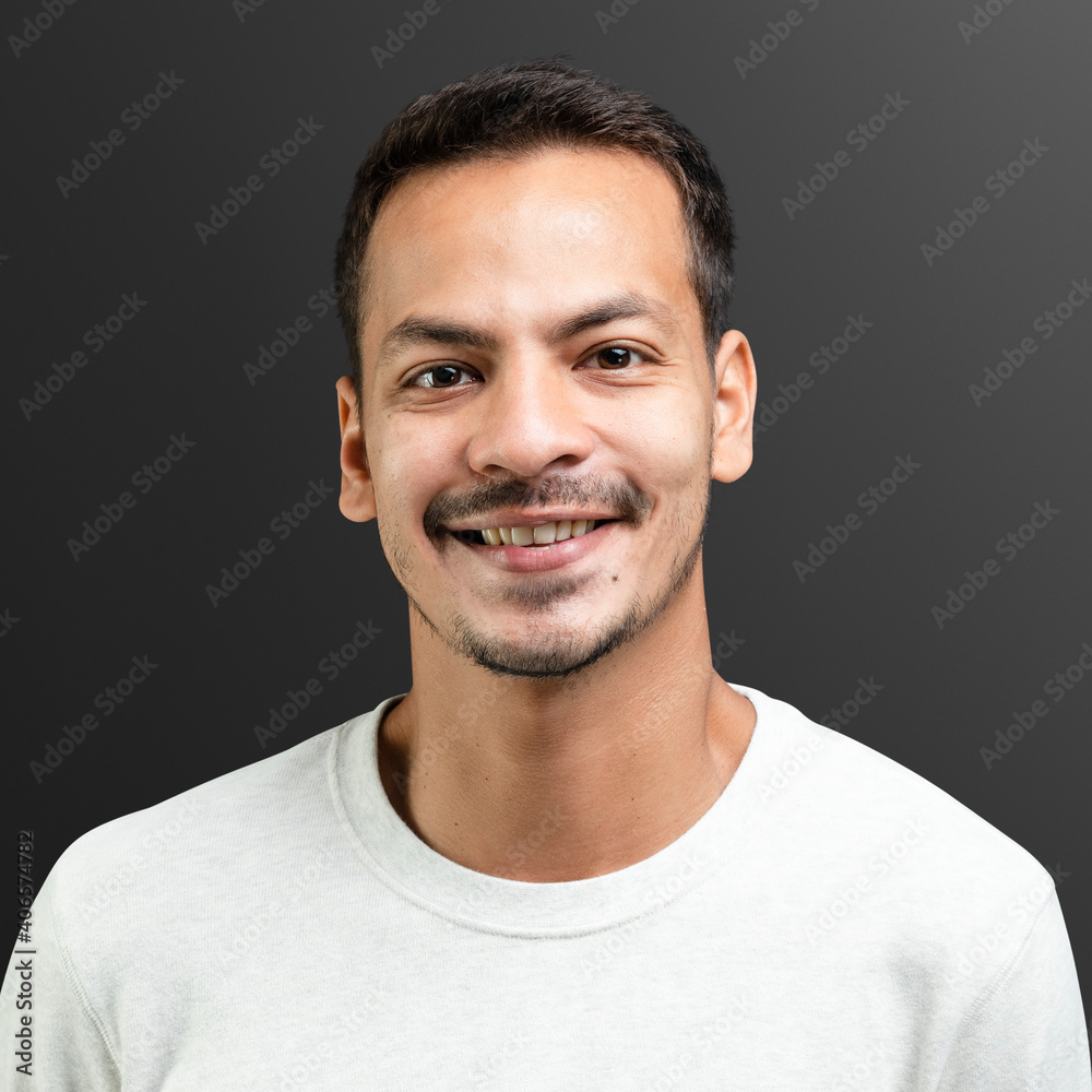 Fototapeta premium Smiling man in white long sleeve tee portrait