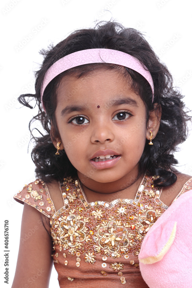 Cute Indian little girl portrait on white.