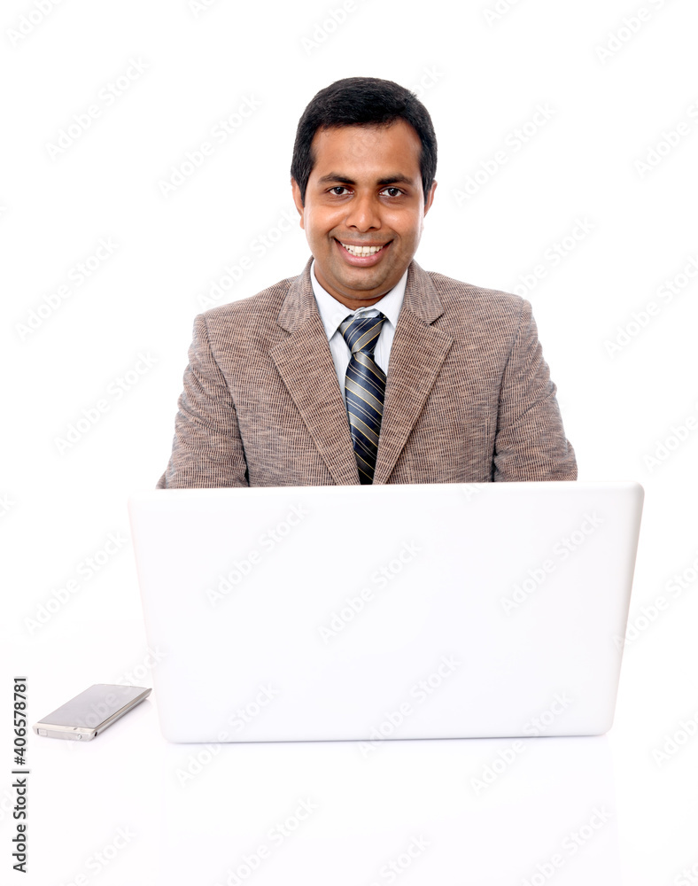 Indian young businessman with laptop isolated on white. Indian young businessman with laptop isolated on white.